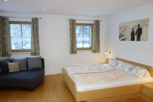 A bed or beds in a room at Ferienwohnung Brugger