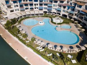 an aerial view of the pool at the resort at Portoverde Luxury Houseboat in Misano Adriatico