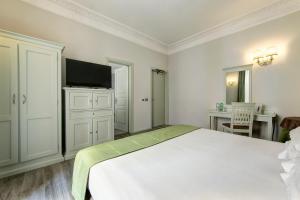 TV a/nebo společenská místnost v ubytování BB Hotels Smarthotel Bailey's