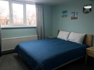 Postel nebo postele na pokoji v ubytování Dudman Hotel