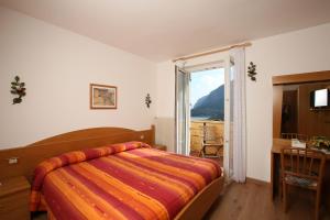 Postel nebo postele na pokoji v ubytování Hotel Garnì Villanova