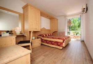 Postel nebo postele na pokoji v ubytování Hotel Garnì Villanova