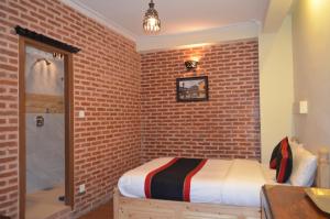 Uma cama ou camas num quarto em Newa Home
