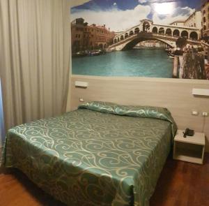 Postel nebo postele na pokoji v ubytování Hotel Altieri