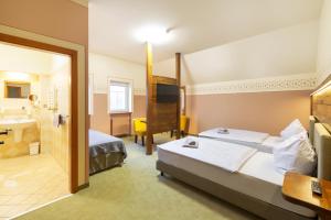 Voodi või voodid majutusasutuse Hotel U Simla toas