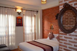 Uma cama ou camas num quarto em Newa Home