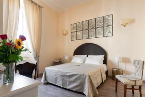 A bed or beds in a room at Vatican Domus Luxury Rooms