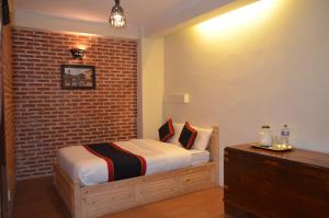 Uma cama ou camas num quarto em Newa Home