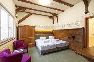 Voodi või voodid majutusasutuse Hotel U Simla toas