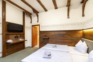 Voodi või voodid majutusasutuse Hotel U Simla toas