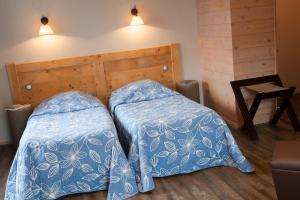 Кровать или кровати в номере le bon accueil