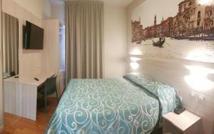 Postel nebo postele na pokoji v ubytování Hotel Altieri