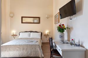 A bed or beds in a room at Vatican Domus Luxury Rooms