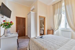 A bed or beds in a room at Vatican Domus Luxury Rooms