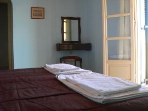 Postel nebo postele na pokoji v ubytování APRAOS BAY HOTEL