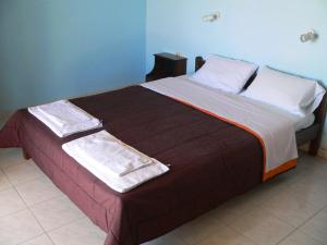 Postel nebo postele na pokoji v ubytování APRAOS BAY HOTEL