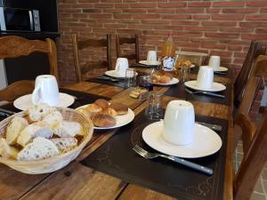 a table with a bunch of pastries on it at La Montagne de Bellot in Bellot