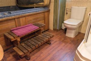 a bathroom with a toilet and a sink at Luna del Valle in Nueva de Llanes