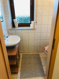 Ein Badezimmer in der Unterkunft Ferienwohnungen SENA, Burgebrach