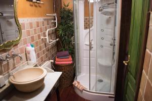 a bathroom with a shower and a toilet and a sink at Luna Del Valle Hotel in Nueva de Llanes +60 photos