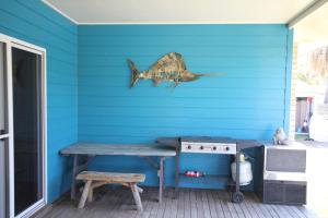 a room with a blue and yellow wall and a blue and yellow wall at CASTAWAY BEACH HOUSE- NO Parties - NO Pets in Agnes Water