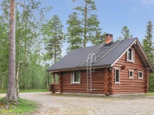 a log cabin in the woods with at Holiday Home Jäkälä by Interhome in Kyrö