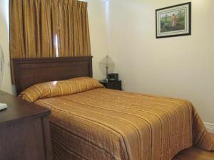 Postel nebo postele na pokoji v ubytování Comerford's Ocean View Suites