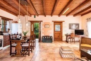 a large kitchen with a table and a dining room at Villa Eleonas in Vamos