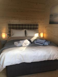 Tempat tidur dalam kamar di Keepers Lodges