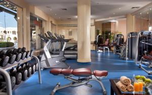 a gym with cardio equipment in a hotel at Charmillion Gardens Aquapark in Sharm El Sheikh