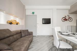 A television and/or entertainment centre at La Fiaba Roma Apartment