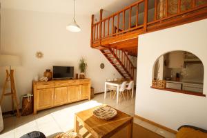 Televízia a/alebo spoločenská miestnosť v ubytovaní Bungalow Balancon duplex