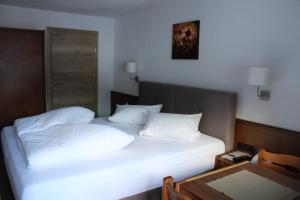 Кровать или кровати в номере Gletscher-Landhaus Brunnenkogel