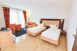 Postel nebo postele na pokoji v ubytování Hotel & Restaurant Pötter