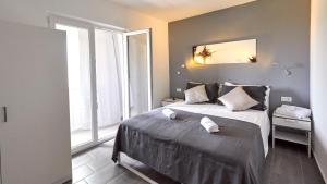 Postel nebo postele na pokoji v ubytování B&B Villa Vela