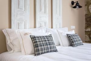 Cama ou camas em um quarto em Casa das Muralhas