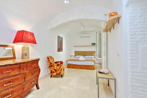 Ένα ή περισσότερα κρεβάτια σε δωμάτιο στο Design Loft Campo dei Fiori