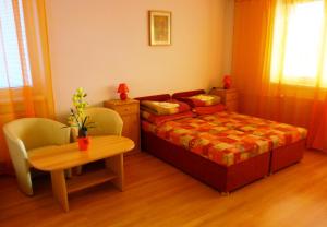 Ένα ή περισσότερα κρεβάτια σε δωμάτιο στο Penzion Fortuna Dudince