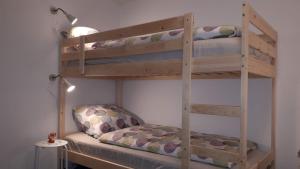 Postel nebo postele na pokoji v ubytování Apartmán Liška v Peci - apartmánový dům Horalka, Pec pod Sněžkou