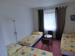 Posteľ alebo postele v izbe v ubytovaní Vila Evička