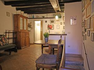 a dining room with a table and a couch at Terrace Apartment - Heart of Trastevere in Rome +5 photos