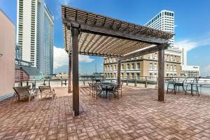 a pavilion with tables and chairs in a city at Spacious Condos close to Art & Culture NOLA in New Orleans