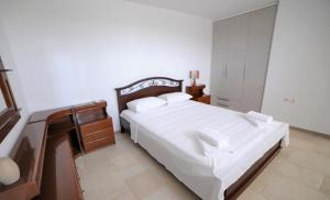 מיטה או מיטות בחדר ב-Villa Busho
