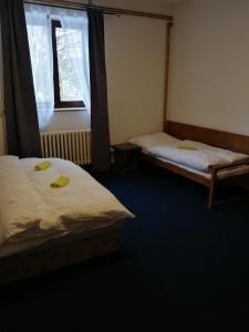 Säng eller sängar i ett rum på Chata Prášily