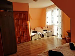 Posteľ alebo postele v izbe v ubytovaní Dom Wczasowy " U Józefa "