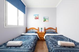 Llit o llits en una habitació de Spacious 3BR 5 min Walk to Las Canteras - Parking