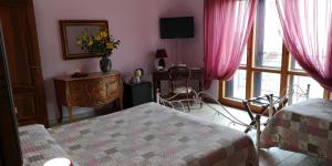 Postel nebo postele na pokoji v ubytování B&B Paola e Francesco