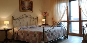 Posteľ alebo postele v izbe v ubytovaní B&B Paola e Francesco