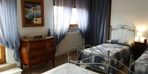 Postel nebo postele na pokoji v ubytování B&B Paola e Francesco