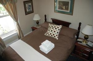Un ou plusieurs lits dans un hébergement de l'établissement Windsor Guest House